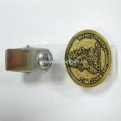 Badge with a clip and plastic strap