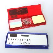 calculator with notepad and clips
