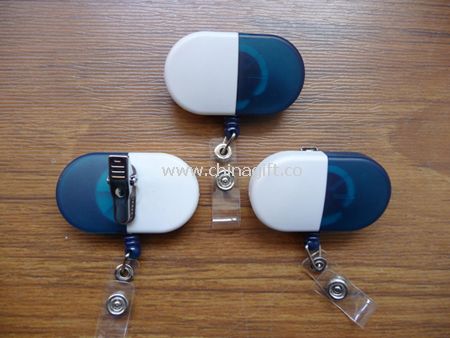 Capsule shaped retractable badge holder