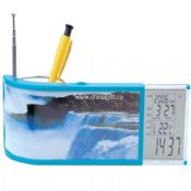 Fancy table calendar radio with photo frame and pen container medium picture