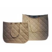 Colorful classic quilted non woven carry bag with veins and twist handle images