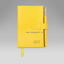 kleines Notizbuch mit Stift images