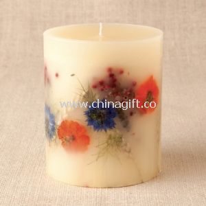 Scent candle with embedded dried flower
