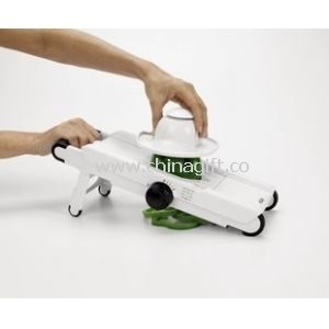 Very versatile V-Blade Mandoline slices fruits and vegetables