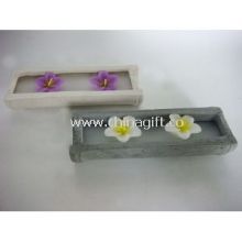 Flower candle in cement holder images